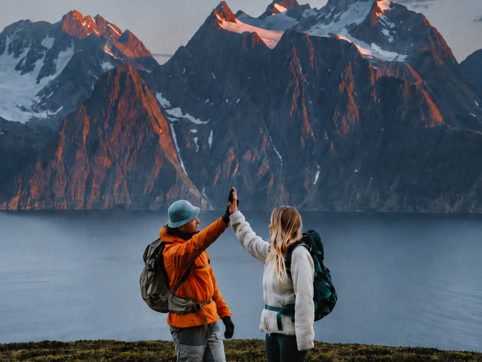 Two hikers overlooking a Nordic mountain landscape, representing how Navigora turns company data into growth.